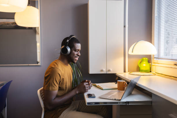 istock Young African American man working at home on laptop 2148328280