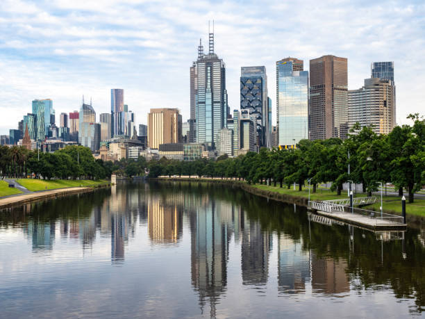 Urban skyline and river on cloudy day