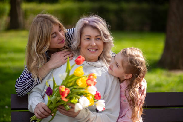 istock Three generations family with tulip bouquet 2148329339