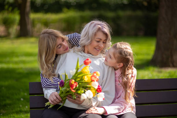 istock Three generations family with tulip bouquet 2148329359