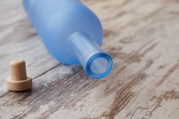 istock An empty vodka bottle and cork lie on a wooden table 2148330045