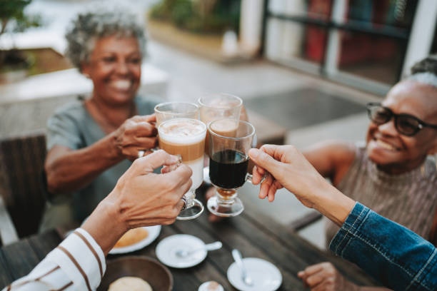 istock Group of senior friends toasting with coffee 2148331769