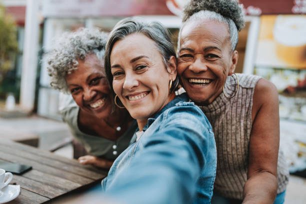 istock Portrait group of friends taking selfie 2148331836