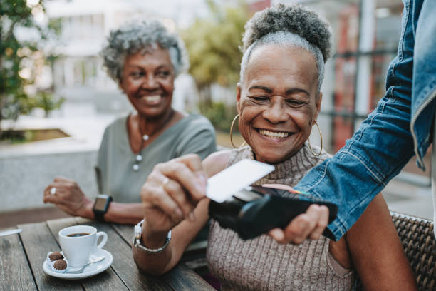 istock Senior woman making credit card payment 2148331837