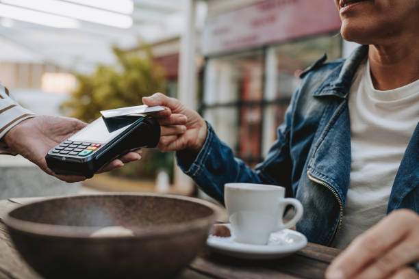 istock Mature woman making payment with credit card 2148331842