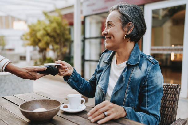 istock Senior woman making credit card payment 2148331843