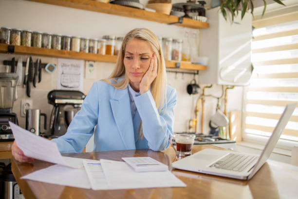 istock Young woman is going through bills and finances 2148331991