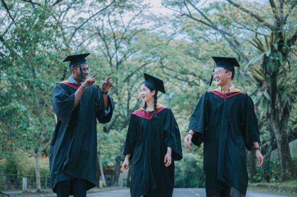 istock exciting Asian graduation  students walking to graduation hall 2148332133