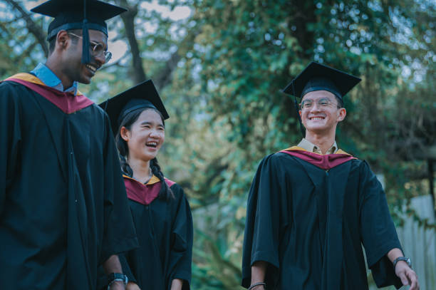 istock exciting Asian graduation  students walking to graduation hall 2148332305
