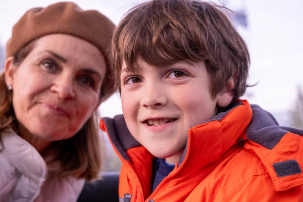 istock Smiling little boy posing with his mother in the background 2148332417