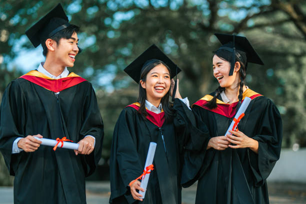 istock Exciting Asian graduation students holding diploma at campus outdoor 2148332708
