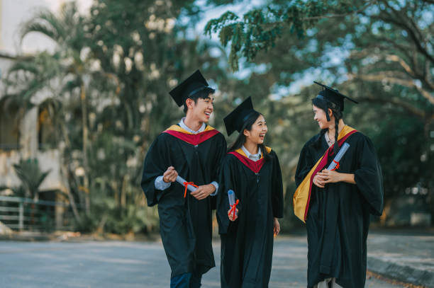 istock Exciting Asian graduation students holding diploma at campus outdoor 2148332742