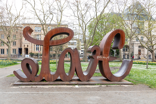 Frankfurt, Germany - April 6, 2024: love hate sculpture from Mia Florentine Weiss  in fromt of senkcenberg museum in Frankfurt.