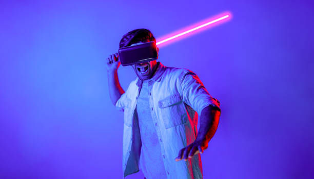 istock Caucasian man wearing VR glass and moving gesture holding sword. Deviation. 2148333942