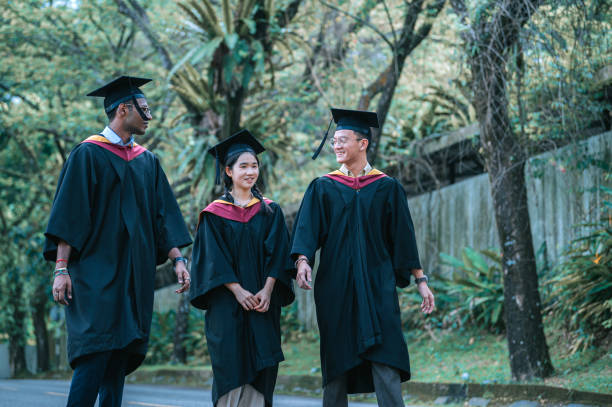 istock exciting Asian graduation  students walking to graduation hall 2148334043