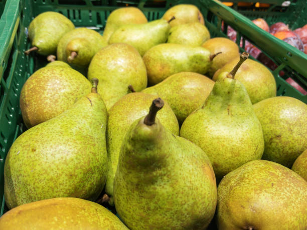 istock Fresh Green Pears in Supermarket Basket 2148334522