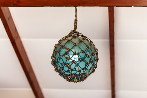 A Glass Buoy Suspended from the Ceiling