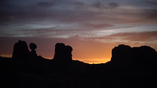 Evening sunset against the backdrop of the mountain landscape, and the red mountains. Canyonlands, Moab, Utah