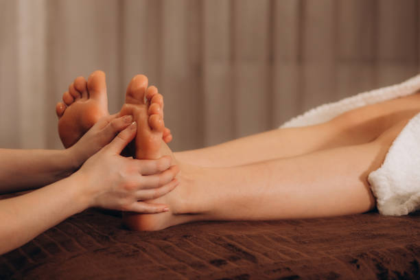 istock Foot massage in spa salon, closeup 2148339101