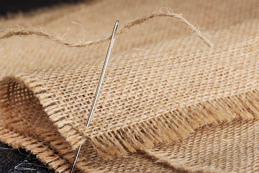 burlap, sewing needle and thick jute thread clo