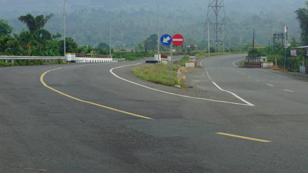 istock asphalt road scenery with mountains in the background 2148342412