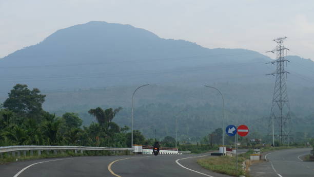 istock asphalt road scenery with mountains in the background 2148342422