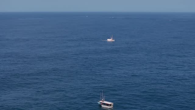 Boats Sailing At The Seascape Near Muxía Coastal Town In Spain. Aerial Drone Shot