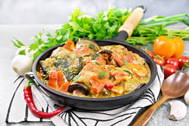 istock Rolls of eggplant with mincemeat in pan on stone 2148344285
