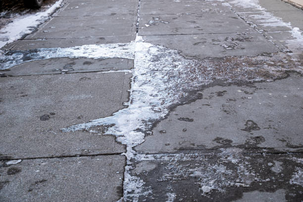 Pavement sidewalk covered in Ice