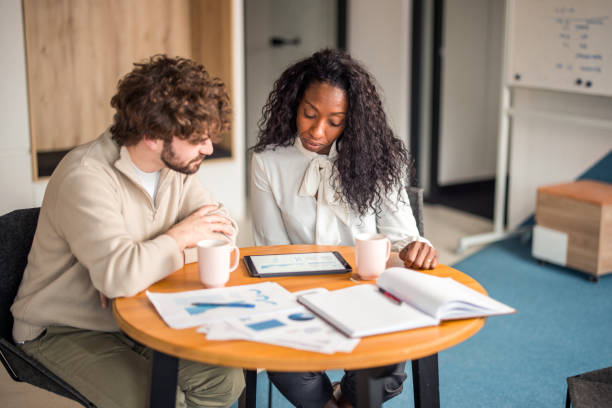istock Diverse Investors Analyzing Market Trends 2148345358