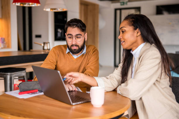 istock Diverse Investors Analyzing Trends on Laptop 2148345373