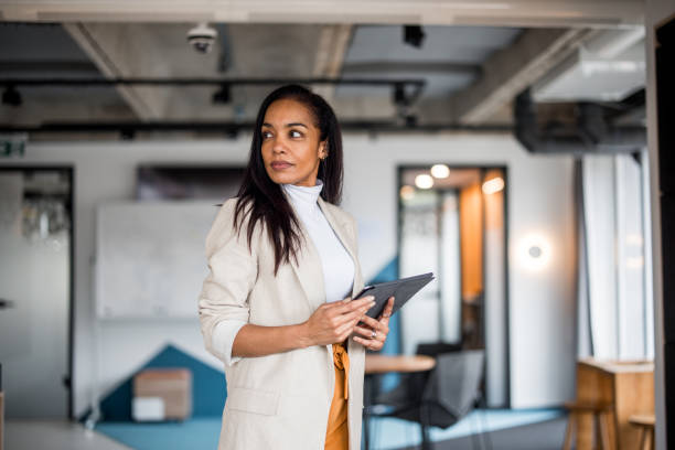 istock Confident Hispanic Businesswoman Analyzing Financial Markets 2148345375