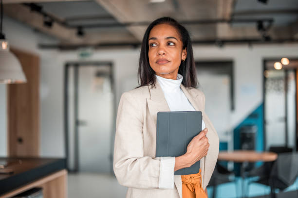 istock Confident Hispanic Businesswoman Analyzing Market Trends 2148345383