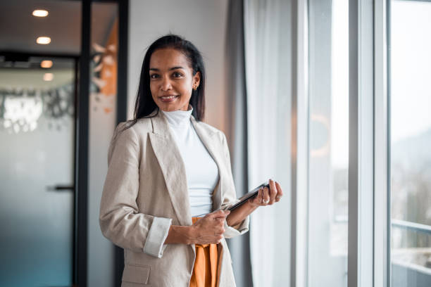 istock Confident Hispanic Businesswoman with Tablet 2148345395