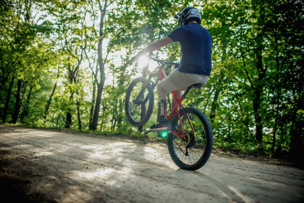 istock man with a prosthetic leg ride a mountain bike on a hill 2148346816