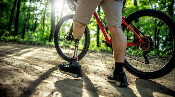 istock man with a prosthetic leg ride a mountain bike on a hill 2148346831
