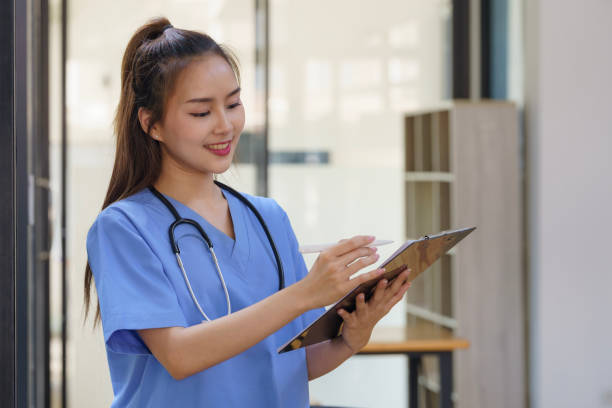 istock Asian female Doctors take note of information about patients in paperwork. 2148348230