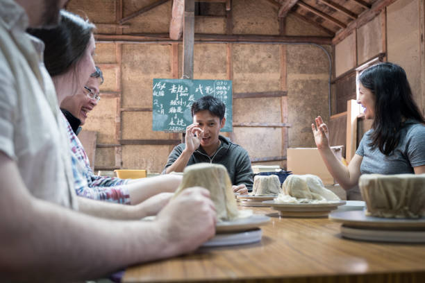 istock Japanese Man Teaching Pottery Class to Multiracial, Multigeneration Tourist Group 2148349073