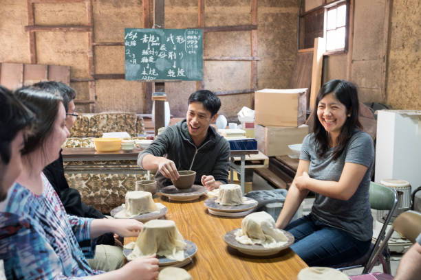 istock Japanese Man Teaching Pottery Class to Multiracial, Multigeneration Tourist Group 2148349079