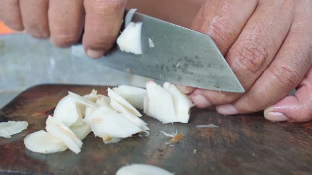 Slicing Fresh Galangal, Thai Cuisine and Aromatic Ingredients