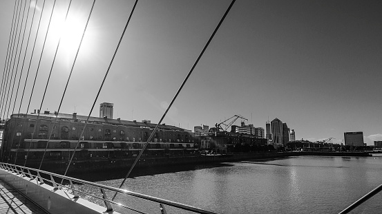 Elegant Span: A detail of the Puente de la Mujer in Puerto Madero, Buenos Aires, Argentina, Showcasing its Modern Design, Gracefully Spanning the Rio de la Plata and Enhancing the City's Waterfront with Contemporary Sophistication
