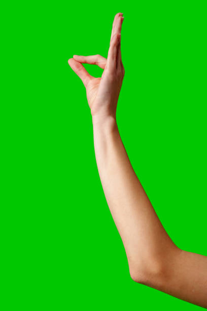 istock Hand Gesturing Okay Sign Against a Vibrant Green Background 2148352818
