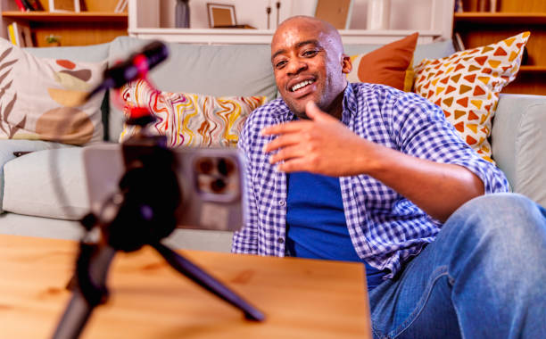 istock Male vlogger recording content for his vlog. 2148353084