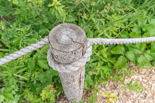 Fencepost with rope on a footpath