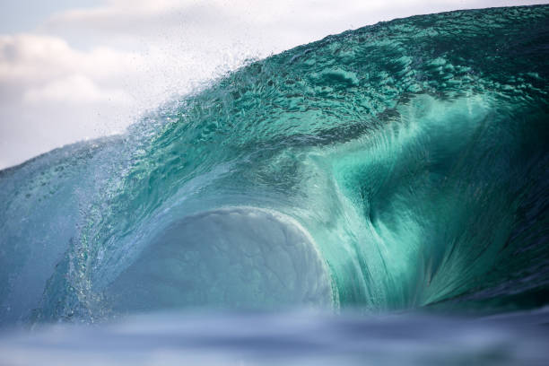 istock Beautiful aqua glass wave breaking over a shallow reef 2148353730