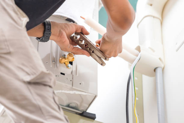 istock Technician man cut joints with the tool of copper pipe to fix and install new air conditioner 2148353955