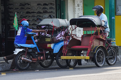 Yogyakarta, Indonesia - December 29, 2023: Modified Javanese Pedicab called Becak Motor or betor. Transportation in Yogyakarta City, Indonesia. Concept for vintage classic retro vehicle, and vacation.