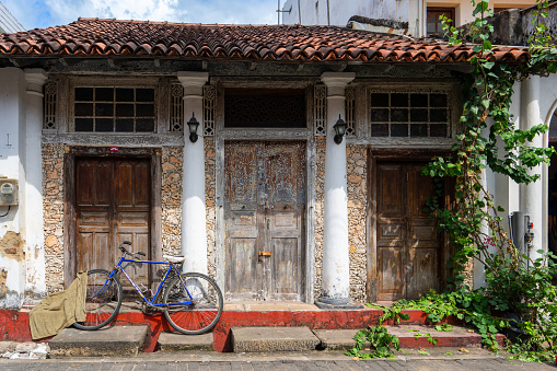 Galle Fort, Sri Lanka, Old building with white walls, wooden doors and red roof. The town combines European architectural art and South Asian cultural traditions. UNESCO World Heritage Site.