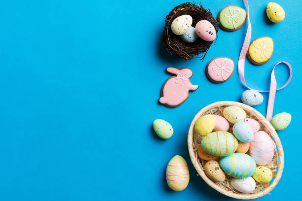 istock Colorful easter eggs in nest on table background with copy space top view 2148354776