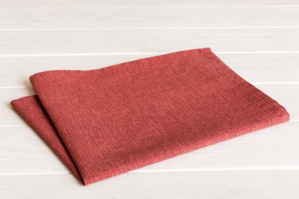 istock top view with red empty kitchen napkin isolated on table background. Folded cloth for mockup with copy space, Flat lay. Minimal style 2148354817